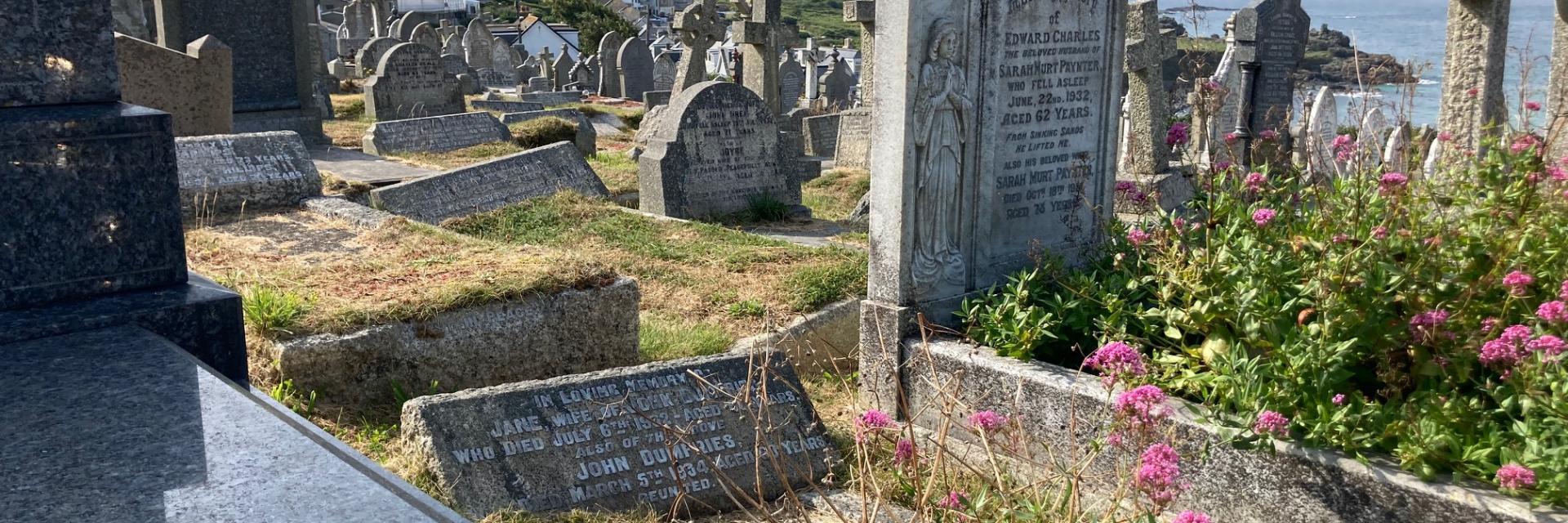 Graves stones overlooking the beach and headland