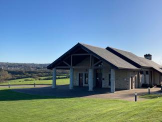 Looking towards the chapel with blue skies and hills in the background