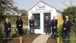 Saints Funerals staff in front of premises