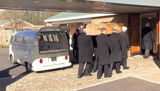 Bearers carrying a coffin on shoulders removed from a restored VW Campervan
